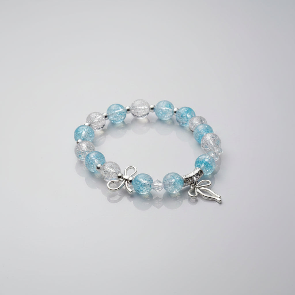 Beaded bracelet with blue and clear beads on a gray background