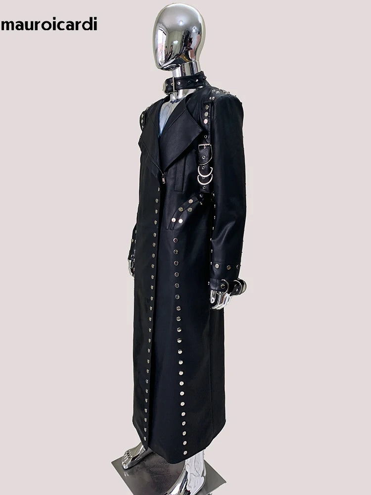 Black studded coat on a mannequin with 'mauroicardi' branding.