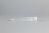 Clear stone tool on a gray background