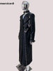 Black studded coat on a mannequin with 'mauroicardi' branding.